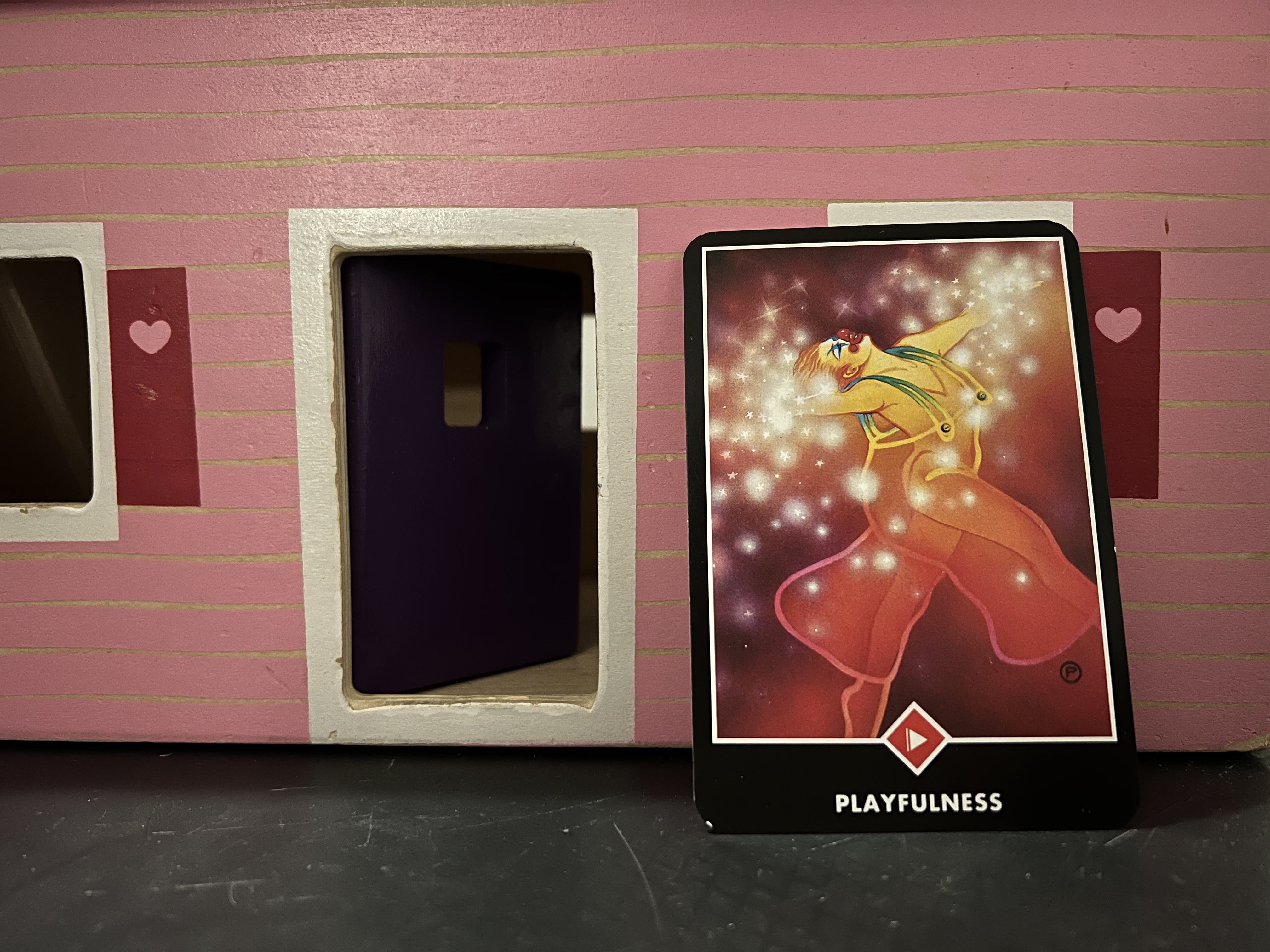 A photo of the OSHO Zen Tarot Deck's Page of Fire Card - Playfulness